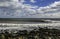 Surfer surfs a perfect wave on a sunny day