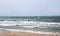 Surfer swims on a board in Mediterranean