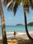 Surfer at tropical Beach, Guadeloupe Island