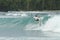 Surfer on tropical wave, Indonesia