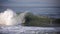 Surfer tubed in wave at sandbar where the Santa Clara River empties into the Pacific Ocean in Ventura California USA