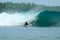 Surfer turning off bottom on big wave, Mentawai Is