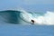 Surfer turning off bottom on big wave, Mentawai Is