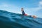 Surfer. Young Man On Surfboard Portrait. Cool Guy In Wetsuit Swimming In Ocean.