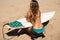 Surfergirl is wating for the perfect wave with surfboard