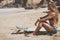 Surfergirl is wating for the perfect wave with surfboard