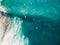 Surfers and barrel wave in tropical blue ocean. Aerial view. Top view
