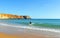 Surfers in the beach of Sagres, Algarve, Portugal