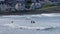 Surfers and bodyboarders enjoying the waves at Portrush Beach North Coast Antrim Northern Ireland