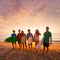 Surfers boys and girls group walking on beach