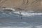 Surfers at Cape Kiwanda During the King Tide of February 2020