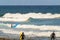 Surfers Entering The Water To Enjoy A Wave Day On Las Americas Beach. April 11, 2019. Santa Cruz De Tenerife Spain Africa. Travel