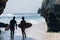 Surfers getting into the sea, ready to surf the waves. Kuta beach, Bali