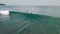 Surfers in the ocean, male surfer catches and ride a massive barreling waves.