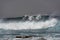 Surfers in the ocean storm, la Santa, Lanzarote, Spain