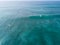 Surfers paddling for catching waves