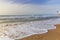 Surfers ride the waves on the Mediterranean coast