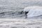 Surfers riding huge waves on the west coast, close to Pillar Point and Mavericks Beach, Half Moon Bay, California