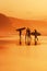 Surfers on the shore at sunset