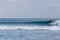 Surfers surf on the waves of the Mediterranean Sea on the beach in Ashdod Israel