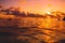 Surfers with surfboard on line up in ocean at sunset or sunrise. Surfer and ocean