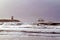 Surfers surfing at sunset in Scheveningen Netherlands