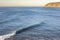 Surfers waiting to catch the wave in the Pacific Ocean at Puertecillo spot in Chile. Amazing waves for surfing in an awe wild