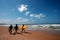 Surfers Walking on the Beach