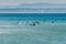 Surfers in the water at Carcavelos beach, Lisbon Region, Portugal