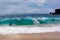 Surfers in the waves at Sandy Beach Hawaii