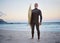 Surfing, beach and senior man on vacation for surf training in nature by ocean in Australia. Travel, surfboard and