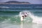 Surfing boy at Arpoador beach in Rio de Janeiro