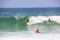 Surfing boy at Arpoador beach in Rio de Janeiro