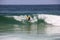 Surfing boy at Arpoador beach in Rio de Janeiro