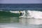 Surfing boy at Arpoador beach in Rio de Janeiro