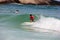 Surfing boy at Arpoador beach in Rio de Janeiro