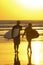 Surfing couple on kuta beach