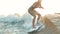 Surfing. Girl wakesurfing in the river and falls. Water extreme sport.