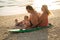 Surfing. happy family sits on the surfboard. concept about family, sport and fun.