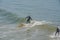 Surfing on the Pacific Ocean at Pismo State Beach in San Luis obispo County, California