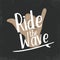 Surfing typography for t shirt print. T-shirt graphics. Surfing shaka hand with lettering Ride the wave