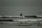 Surfing the waves on the beach of Matosinhos