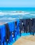 Surfing wetsuits drying on beach