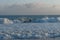 Surfing at Zuma Beach at sunset at high tide, Malibu, California