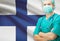 Surgeon with national flag on background series - Finland