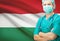 Surgeon with national flag on background series - Hungary