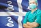 Surgeon with national flag on background series - Martinique