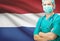 Surgeon with national flag on background series - Netherlands