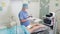Surgeon prepares instruments before sclerotherapy procedure in operating room