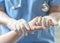 Surgeon, surgical doctor, anesthetist or anesthesiologist holding patient`s hand for health care trust and support in professional